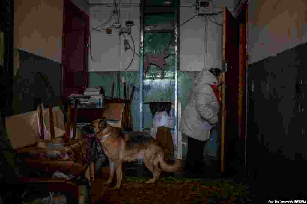 Lidia Dmitrievna Sholicheva, a human rights activist, visits one of a few friends who still live in Sovetskiy.