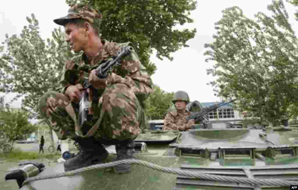 Soldiers patrol downtown Andijon in an armored personnel carrier on May 15 - Tensions had been rising for months in Andijon prior to the events of May 12 and 13, 2005.