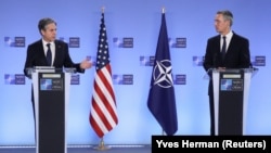 U.S. Secretary of State Antony Blinken (left) and NATO Secretary-General Jens Stoltenberg deliver remarks at NATO headquarters in Brussels on March 23.