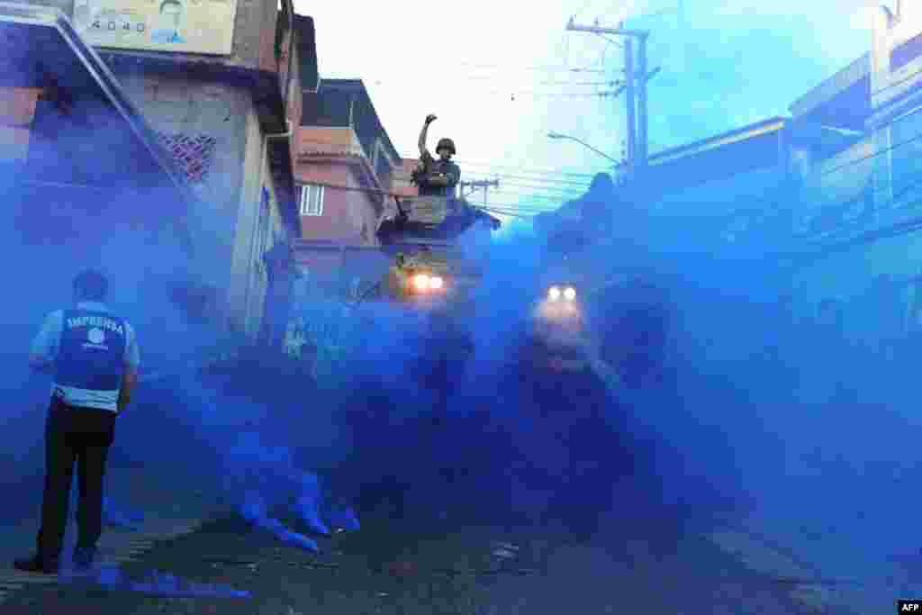 Brazilian security forces clear a slum in Rio de Janeiro on June 19 as part of preparations for the country's hosting of the football World Cup in 2014.Photo by Vanderlei Almeida for AFP