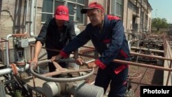 Armenia -- Workers at a natural gas distribution facility.