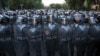 Armenia -- Police block a street during a protest against an increase of electricity prices in Yerevan, June 23, 2015