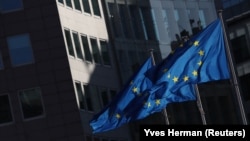 European flags flutter outside the EU Commission headquarters in Brussels.