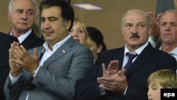 Georgian President Mikheil Saakashvili (left) and his Belarusian counterpart, Alyaksandr Lukashenka (right), with his son, Mykalay, attend the Euro 2012 final in Kyiv.