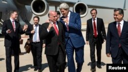 U.S. Secretary of State John Kerry (centre-right) talks with Kurdish officials in Iraq. 