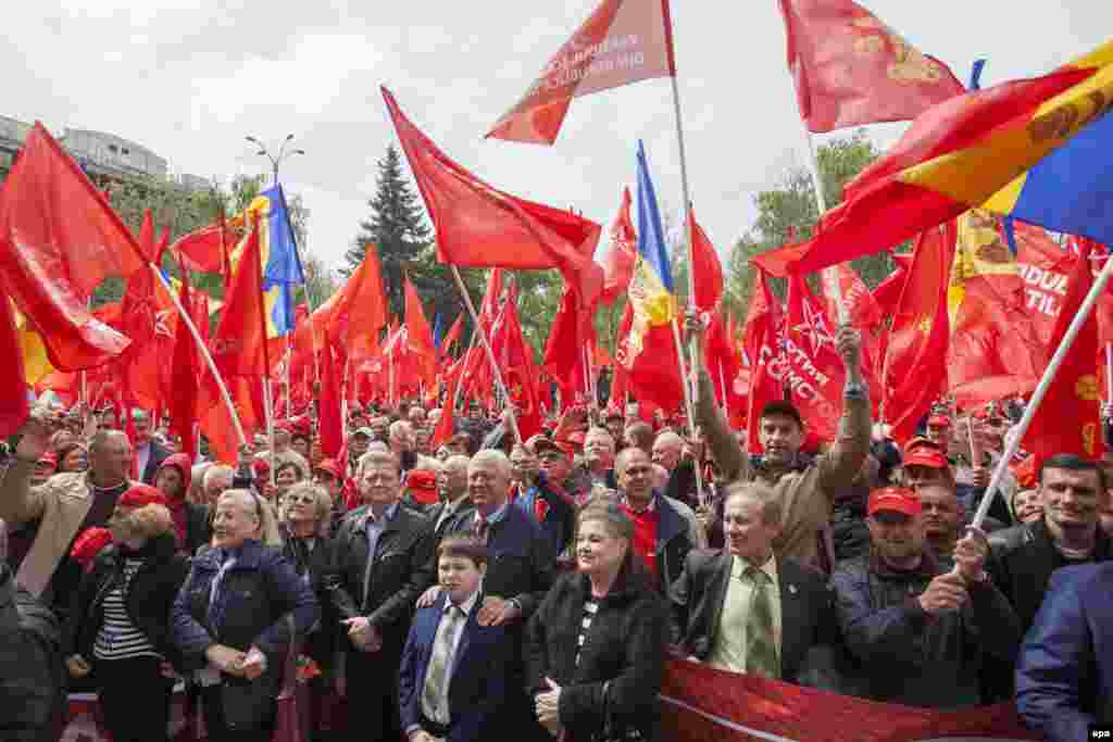 Supporters of the Socialist Party of Moldova attend a rally on the occasion of May Day in front of the National Opera and Ballet Theater Chisinau on May 1. (epa/Dumitru Doru)