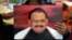 Supporters of Pakistan's Muttahida Qaumi Movement (MQM)party hold photographs of party leader Altaf Hussain during a June protest in Karachi.