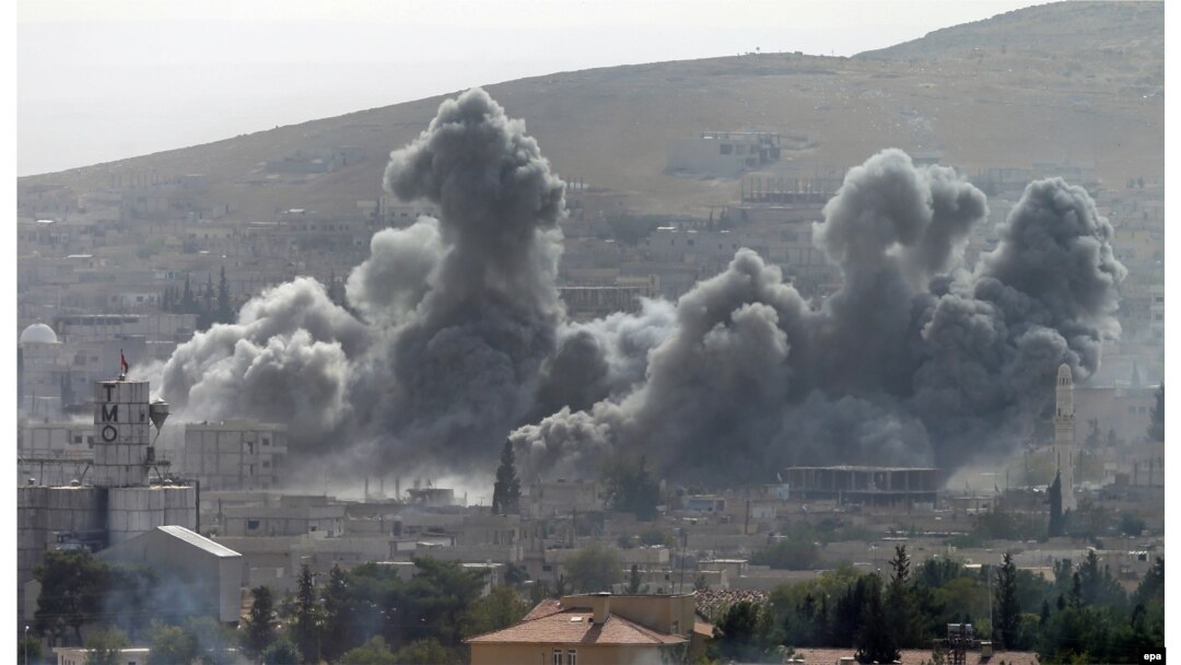 Smoke rises after an air strike by the U.S.-led coalition against Islamic State targets in Kobani on October 13.