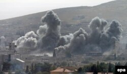 Smoke rises after an air strike by the U.S.-led coalition against Islamic State targets in Kobani on October 13.