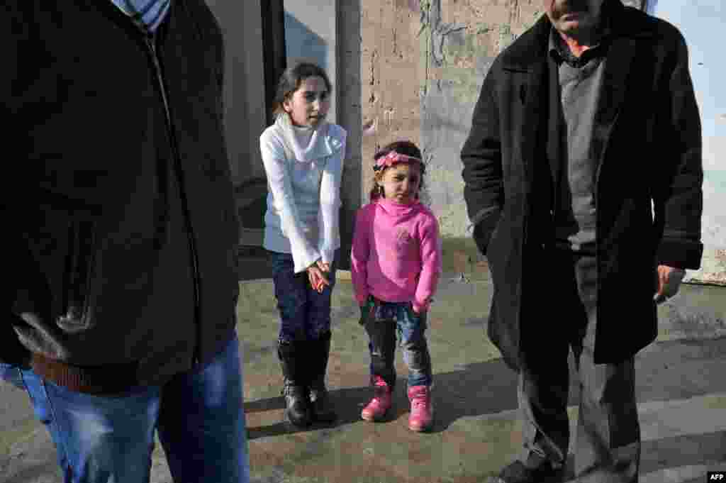 Armenia -- Children of member sof Yezidi look at a stranger in the Armenian village of Zovuny, 01May2013
