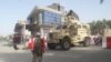 FILE: An Afghan soldier stands guard at the entrance of a government compound in Farah Province, western Afghanistan May 15, 2018.