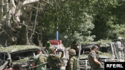 NATO soldiers secure the site of the attack on August 15