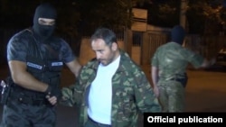 Armenia - Artur Sargsian surrenders to security forces at the end of their standoff with opposition gunmen in Yerevan, 31Jul2016.