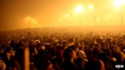 FILE: A massive gathering of devotees at the banks of Sangam, the confluence of three of the holiest rivers in Hindu mythology - Ganga, Yamuna and the mythical Saraswati, in Allahabad, Uttar Pradesh, India.