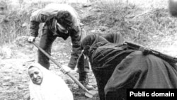 A woman in Iran is prepared for stoning (undated).