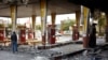 Iran -- An Iranian man checks a scorched gas station that was set ablaze by protesters during a demonstration against a rise in gasoline prices in Eslamshahr, near the Iranian capital of Tehran, on November 17, 2019. - President Hassan Rouhani warned tha