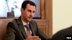 Key details, such as Syrian President Bashar al-Assad's role in the transition, remained unresolved.