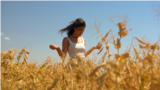 Moldova, Farmer Cristina Bejereanu in a wheat field, wheat