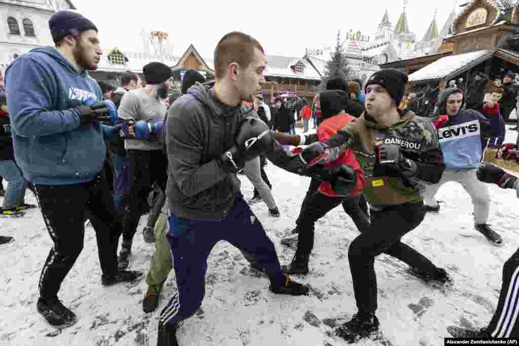 Friendly sparring between groups of men is part of the Maslenitsa festivities, such as these Russian men at the Izmailovsky Kremlin in Moscow.
