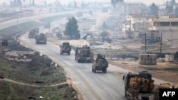 A Turkish military convoy driving through Syria's northwestern Idlib province, February 15, 2018.