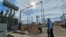Moldova, Energy Minister Dorin Junghietu (right) at the construction site of the Vulcanesti power station