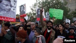 Human rights activists chant slogans during a protest to condemn the disappearances of social activists in Karachi on January 19.