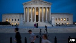 U.S. -- People jog past the United States Supreme Court in Washington, January 31, 2017