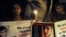 Pakistani civil society activists carry candles to pay tribute to Malala Yousafzai in Lahore.