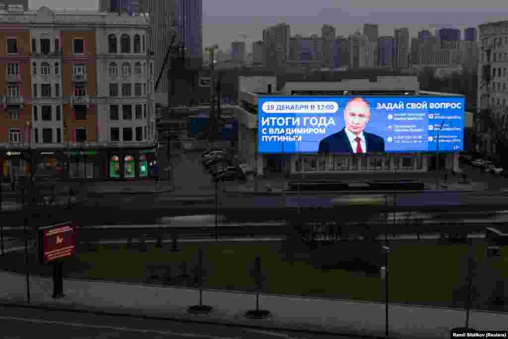 A digital screen in Moscow on December 18 advertises the year-end phone-in and press conference of Russian President Vladimir Putin.Photo by Ramil Sitdikov/Reuters.