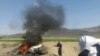  A car is seen on fire at the site of a drone strike believed to have killed Afghan Taliban leader Mullah Akthar Mansur in southwest Pakistan on May 21.