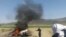  A car is seen on fire at the site of a drone strike believed to have killed Afghan Taliban leader Mullah Akthar Mansur in southwest Pakistan on May 21.