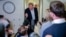 US President Donald Trump speaks to reporters aboard Air Force One on his return to the United States following a visit to Ireland.