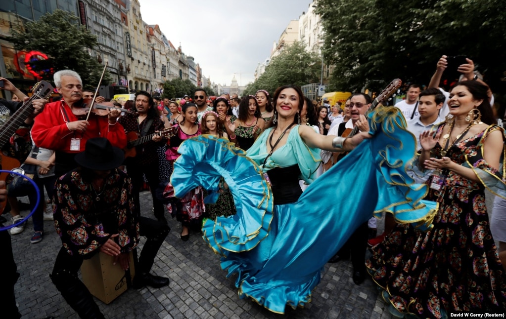 Participants of the Khamoro World Roma Festival dance through the historic center of Prague, Czech Republic. (Reuters/David W Cerny)