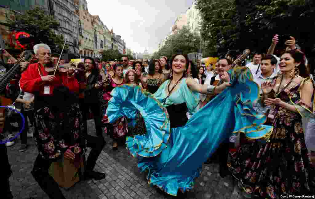 Participants of the Khamoro World Roma Festival dance through the historic center of Prague, Czech Republic. (Reuters/David W Cerny)