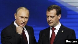 President Dmitry Medvedev (right) and Prime Minister Vladimir Putin addressing a United Russia party congress in Moscow in the run-up to parliamentary election. 