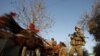 A cart passes a German soldier in the city of Iman Sahib, north of Konduz, Afghanistan. <br /><br />Photo by Fabrizio Bensch for Reuters