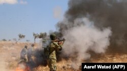 A Syrian rebel fighter from the recently-formed "National Liberation Front" takes part in combat training at an unknown location in the northern countryside of the Idlib province, September 11, 2018