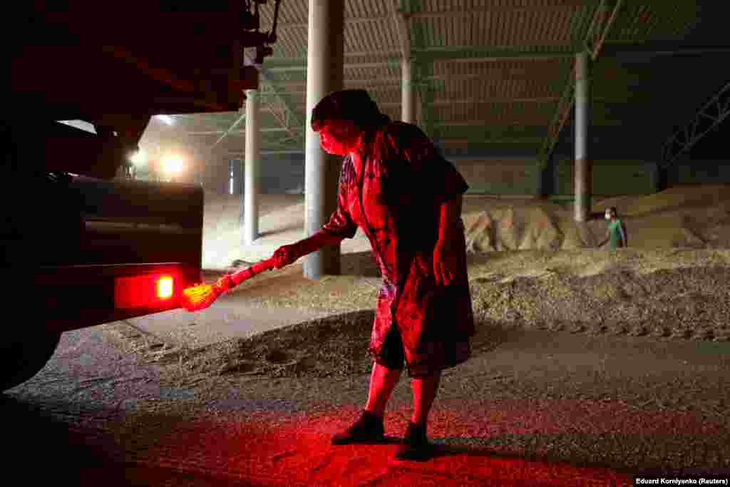 An employee works at a grain store during wheat harvesting in the village of Kamennobrodskaya in Russia's Stavropol region. (Reuters/Eduard Korniyenko)