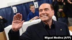 ITALY -- Silvio Berlusconi, leader of right-wing party Forza Italia, waves before to vote at a polling station in Milan, March 4, 2018