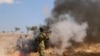 A Syrian rebel fighter from the recently-formed "National Liberation Front" takes part in combat training at an unknown location in the northern countryside of the Idlib province, September 11, 2018