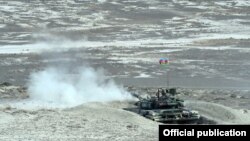 Azerbaijan - A Russian-made tank opens fire during an Azerbaijani military exercise, 26Jun2014.