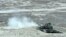 Azerbaijan - A Russian-manufactured tank opens fire during an Azerbaijani military exercise, 26Jun2014.