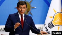 Turkish Prime Minister Ahmet Davutoglu speaks during a news conference at AKP headquarters in Ankara on May 5.