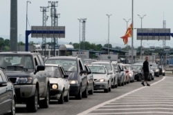 Cars wait in line at the border city of Presevo between Serbia and North Macedonia. (file photo)