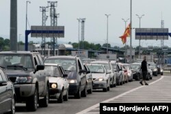 Cars wait in line at the border city of Presevo between Serbia and North Macedonia. (file photo)