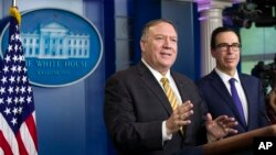 U.S. Secretary of State Mike Pompeo (left) and Treasury Secretary Steve Mnuchin answer questions during a briefing on terrorism financing at the White House on September 10 in Washington.