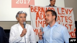 French philosopher Bernard-Henri Levy (left) looks on after the attack in Belgrade on May 10.