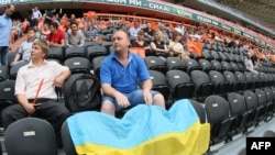 People take part in a peace rally held at the Donbas-Arena in the eastern Ukrainian city of Donetsk on May 20.