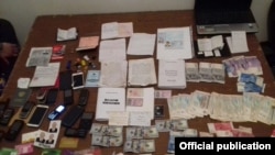 Material displayed by Kyrgyz security services, which they say was found at the residence of an alleged member of the Hizb-ut-Tahrir Islamic group in Osh. 