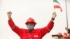 A worker of the Venezuelan state oil company Pdvsa holds an Iranian flag during the arrival of the Iranian tanker ship Fortune at the El Palito refinery in Puerto Cabello, Venezuela, on May 25.